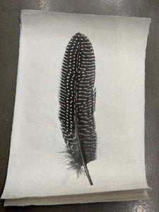 Handmade paper feather art with magnetic frame