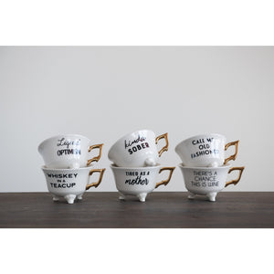 Stoneware teacup “Liquid Optimism”